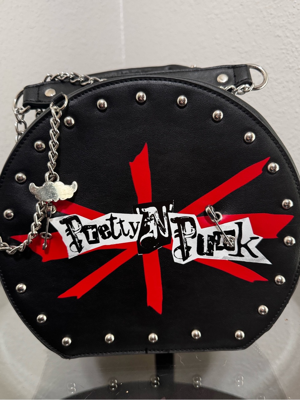 Pretty N Punk Black Round Studded Crossbody Bag with Red Graphic